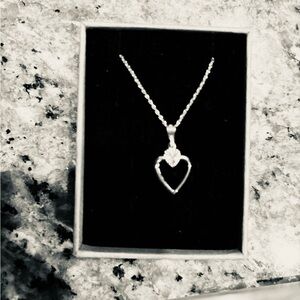 Sweet little open heart sterling silver necklace on a 20 in. SS chain. NEW.